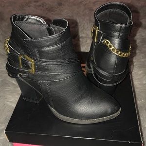Black boots with gold accents